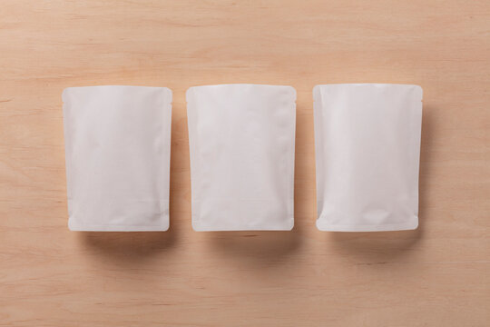 Still Life Pack Shot of Empty Baby Food Packaging with Product Sample
