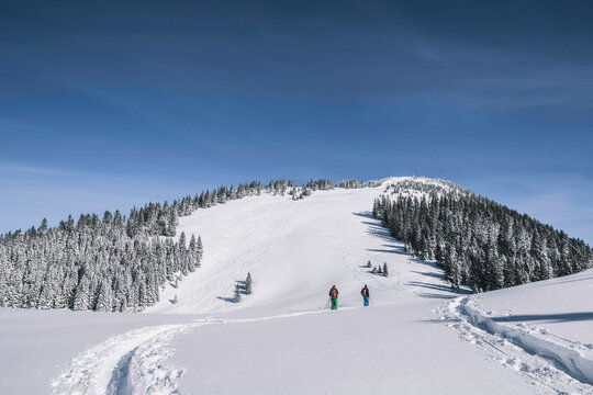 Skier Ski Mountaineering Through Fresh Powder in the Mountains. Spitzingsee, Germany