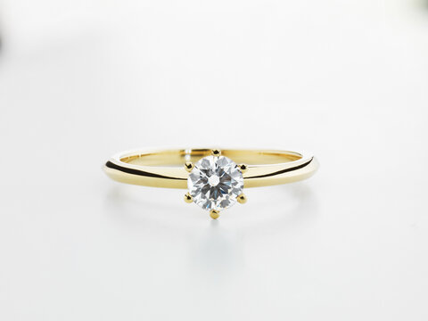 Still Life of a Diamond Engagement Ring on a White Background.