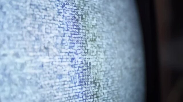 Static noise on an old television screen. Represents the disruption of communication and nostalgia for vintage technology