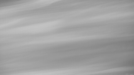 Obraz premium Gray background, gray sky and clouds in the photo in the form of various lines and stripes with gradient transitions