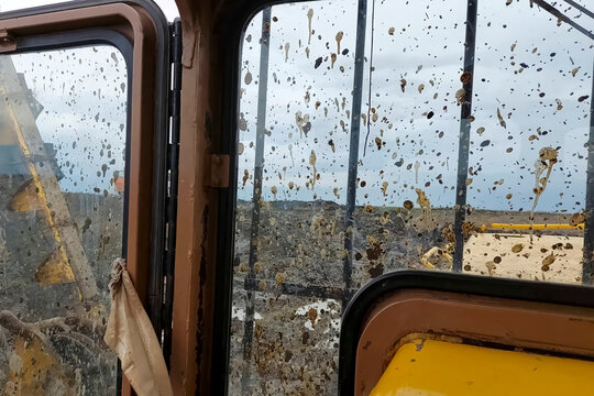 Dirt stained pipelayer cab windows while laying a gas pipeline i