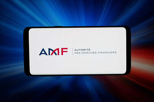 Stuttgart, Germany - 03-26-2026: In this photo illustration, the logo of French Autorite des Marches Financiers (AMF) is displayed on a smartphone in front of abstract background on computer screen.
