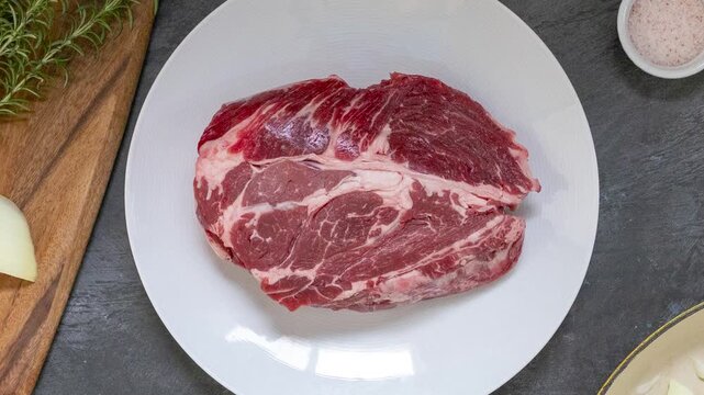 Rotating Plate of Raw Beef for Pot Roast