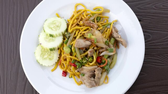 Delicious Plate of Stir Fried Spicy Thai Noodles with Pork and Vegetables