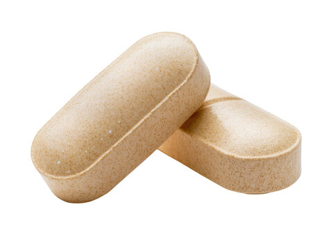 Isolated pair of beige speckled oblong dietary supplement pills for daily health and wellness.