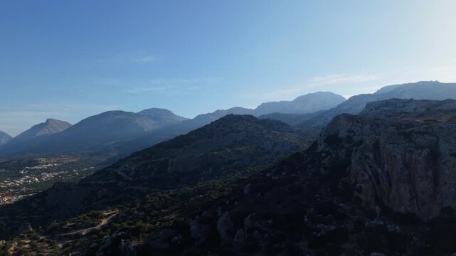 4K cinematic view of Prophet Elias Monastery isolated on a mountain peak, glowing in soft morning light. Peaceful Orthodox religious landmark in nature.