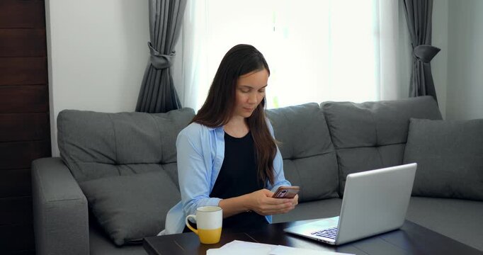 Peaceful woman diligently entering information into her computer workspace. Tranquil female meticulously managing spreadsheets and documents in wellorganized environment with sunlight