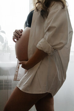 Serene expecting mother embracing maternity