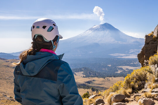 Adventurer gazing at majestic mountain landscape