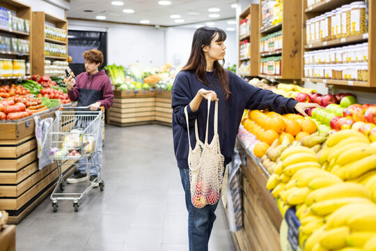 Couple shopping for fresh produce in a fruit store