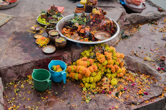 Spiritual offering of flowers by river in India