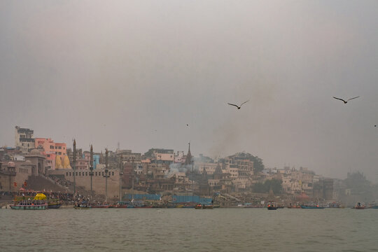 Misty morning view of Varanasi ghats along the Ganges