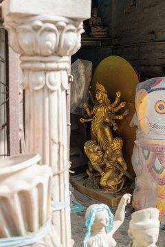 Golden statue of a goddess in Indian shop corner