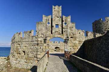 Pili Agiou Paviou Gate, Rhodes Island, Greece. The old town city walls which circle it, this gate is very different from the others not as robust but attractive and extension to the marina. © alagz