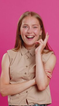 Amused lovely woman pointing finger to camera, laughing out loud, taunting making fun of ridiculous appearance, funny joke anecdote. Pretty blonde lady isolated alone on pink studio background