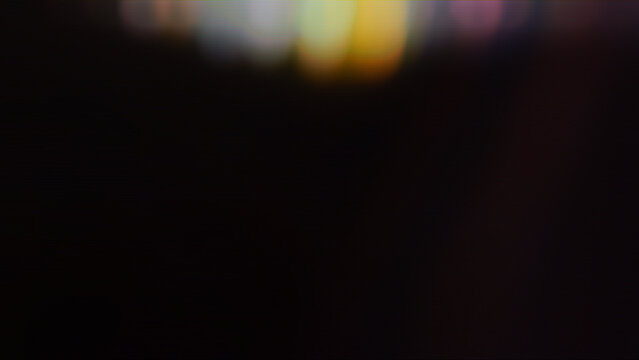 Abstract bokeh light leaks, colorful blur on black background, cinematic lens flare overlay, soft out of focus glowing lights, dark aesthetic background