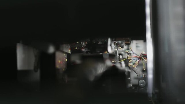 Industrial operator on cables crimp machine in production plant