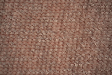 macro texture of soft pink plush fabric. Close-up of cozy textile with delicate fibers and warm pastel tones. Smooth, soft surface creates a calm and comfortable background perfect for fashion, home d © Анна Климчук