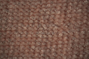 macro texture of soft pink plush fabric. Close-up of cozy textile with delicate fibers and warm pastel tones. Smooth, soft surface creates a calm and comfortable background perfect for fashion, home d © Анна Климчук