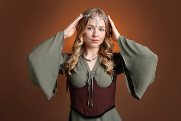 Obraz premium Beautiful elf girl on brown gradient background