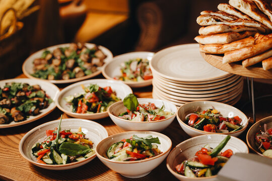 Assorted Salads and Fresh Bread Display