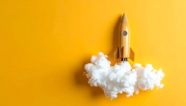 Cohete de cartulina con humo de algod&oacute;n sobre fondo amarillo, ideas, emprendimiento, innovaci&oacute;n, startups marketing, tecnolog&iacute;a, crecimiento, imaginaci&oacute;n y exito en desarrollo de proyectos