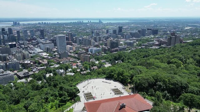 4K aerial drone view above Kondiaronk Belvedere overlooking downtown Montreal skyline