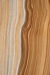 Naklejka premium Wavy eroded sandstone layers forming abstract rock textures. Natural geological patterns from desert erosion. Earth science concept highlighting sedimentary rock formations and landscape beauty