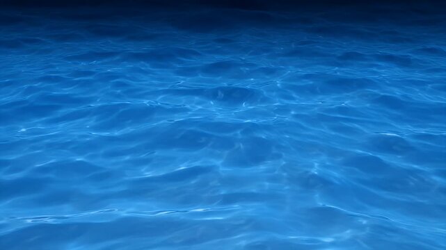 Serene and mesmerizing blue ocean surface with gentle ripples and refracted sunlight