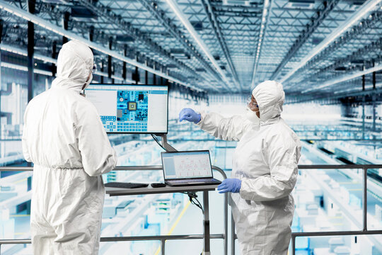 Hardware designers in microchip smart factory using EDA software to visualize machinery arrangements. Industry 4.0 microelectronics manufacturing plant specialists using application, brainstorming