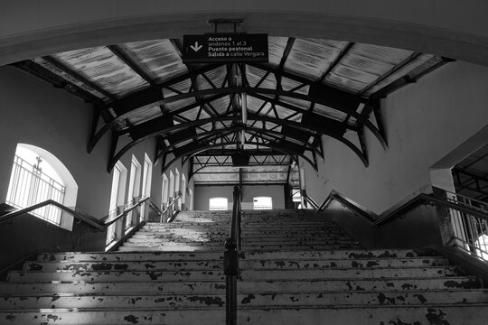 View of the train station in Banfield, Argentina.  Black and white photograph.,