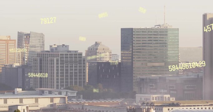 Animation of multiple changing numbers floating against aerial view of cityscape