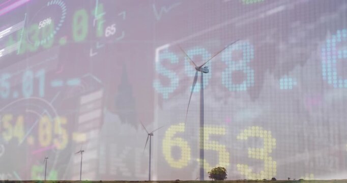 Animation of stock market data processing over spinning windmills against grey sky