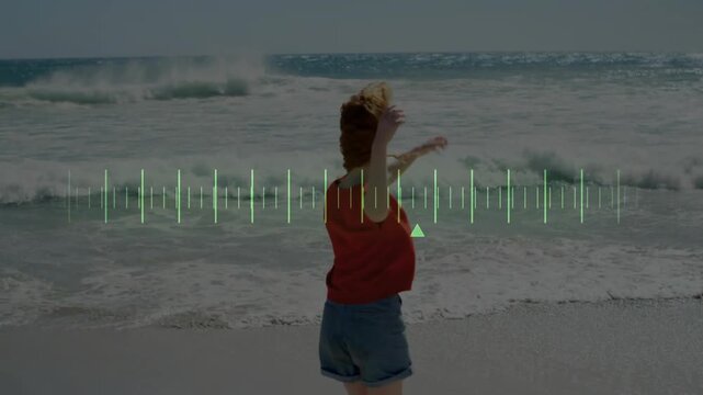 Child playing on beach with soundwave animation over ocean waves