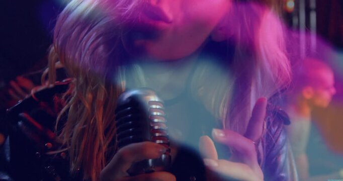 Female singer performing on music stage, projecting animated microphone, soundwave and neon icons