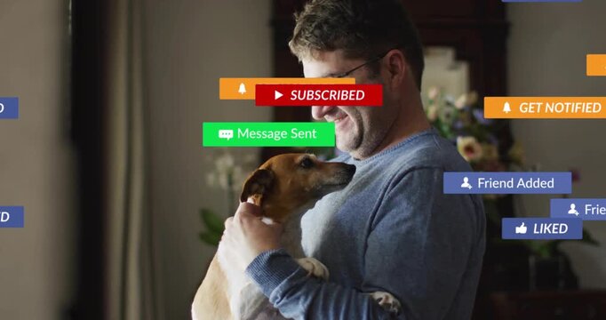 Man cooing and cradling dog triggers drifting social media notification icons across living room