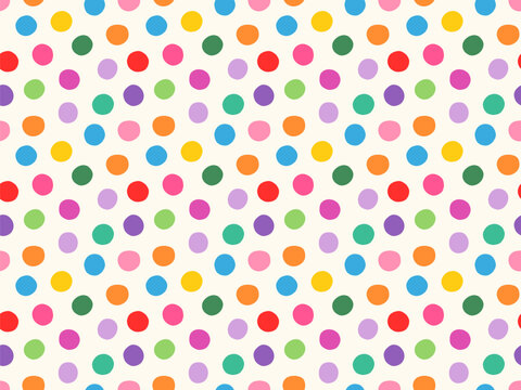 Colorful bright polka dots with irregular shapes seamless vector pattern, Multicolored round spots for children design and birthday wrapping paper
