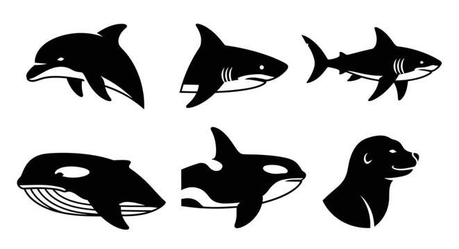 Whale and dolphin silhouettes collection isolated on white.