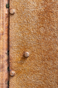 Rusty metal surface with bolts and texture details