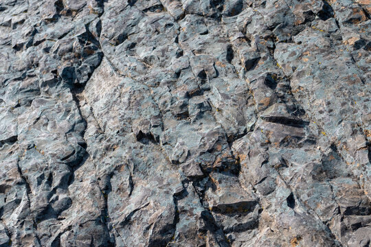 Rock texture in natural setting with sunlight