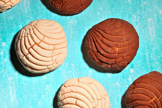 Latin American pastry background, colorful composition of traditional conchas bread