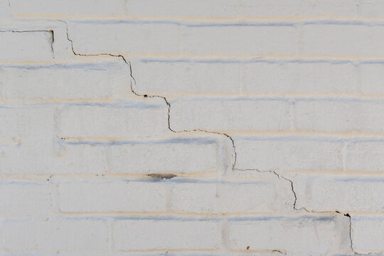 Damaged cracked wall in building