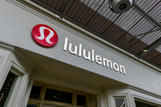Lululemon retail storefront signage mounted on commercial building exterior, representing athletic apparel branding, consumer retail operations, and lifestyle fashion business
