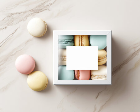 Colorful macarons arranged in a box with blank label on marble background