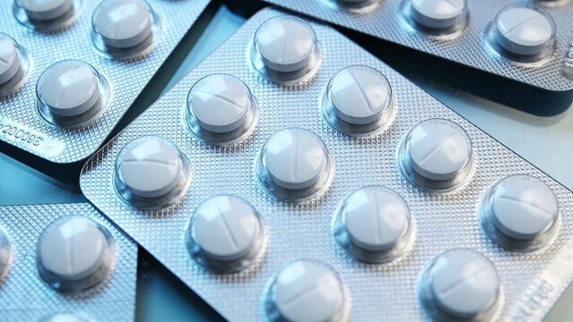 Essential White Pharmaceutical Tablets in Silver Blister Packaging
