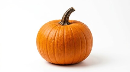 Obraz premium A single, vibrant orange pumpkin sits isolated on a clean white background, captured in a studio with a bright, natural light.