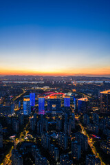 Fototapeta premium Aerial view of modern city at sunset