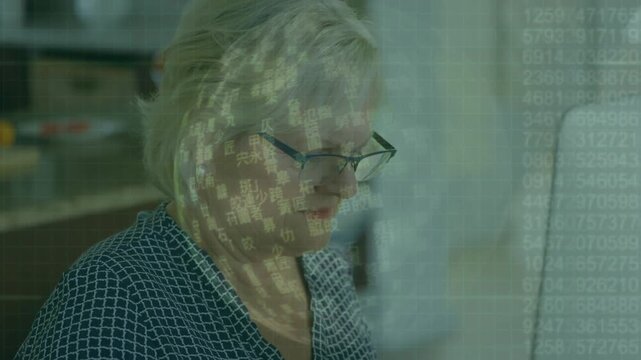 Animation of increasing digits, foreign language on globe, senior caucasian woman working on desktop
