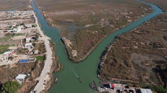 The Al-Jubaysh Marshes, located in Dhi Qar, Iraq, are part of the Mesopotamian marshlands, one of the world's largest wetland ecosystems. Known for their rich biodiversity, these marshes are home to u